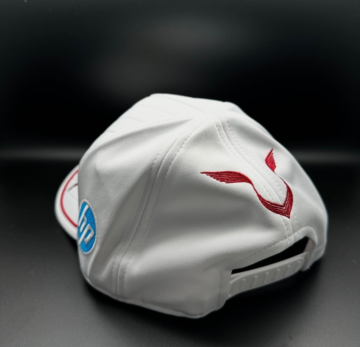 A true collector’s piece — Ferrari official cap signed by Formula 1 legend Lewis Hamilton.