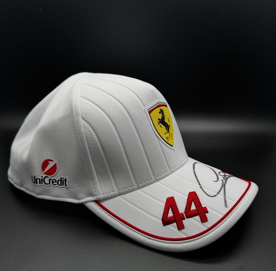 A true collector’s piece — Ferrari official cap signed by Formula 1 legend Lewis Hamilton.